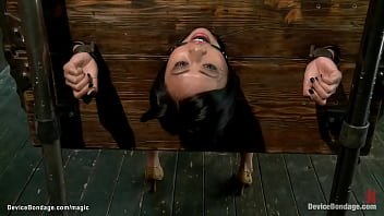 Asian ultra-cutie locked in wall and ball-gagged for your delectation