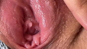 Heavy close-up of a nubile girl's humid and luscious muff as she prepares for invasion